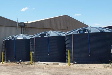 a row of liquid fertiliser tanks installed outdoor