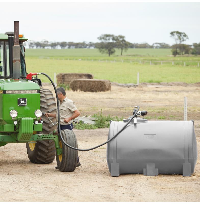 A farmer pumping diesel to his tractor using the Polymaster's Diesel Transfer Unit