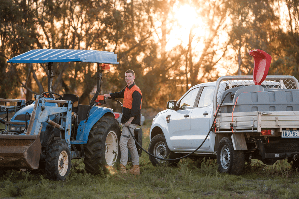 Man filling his tractor using Polymaster's Diesel Ute Pack