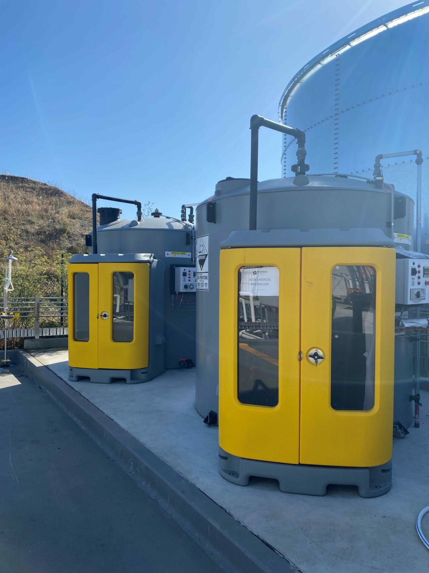 Polymaster yellow dosing cabinets in a water treatment plant