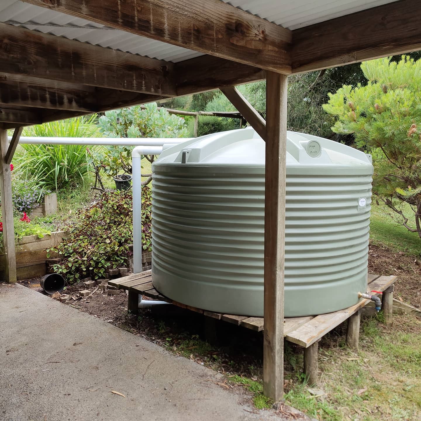 Polymaster light green water tank installed on a residential property