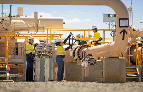 Three engineers in an industrial outdoor