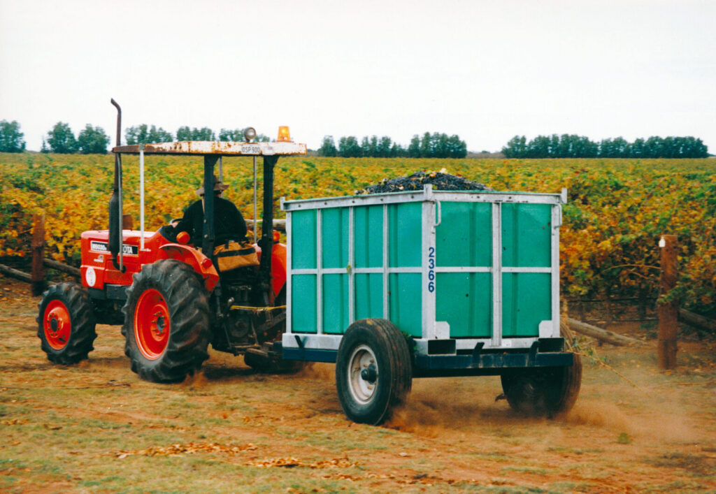 Tractor towing a grape bin