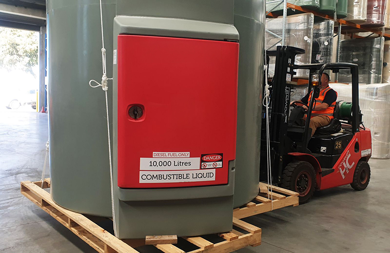 Polymaster diesel tank being lifted by fork lift