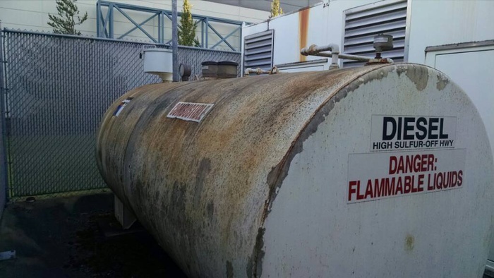 a rusty traditional steel diesel tank